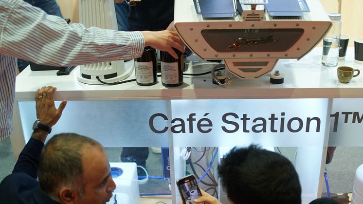 A professional barista uses the Bluewater Café Station to brew coffee, highlighting how purified water elevates flavor from “